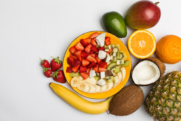 Fruit salad from banana, strawberry, orange, coconut and etc.