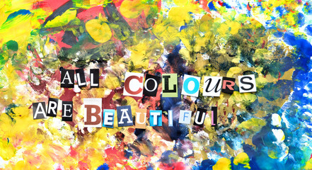 All colours are beautiful paper letters cut from magazines, colorful background. Stop racism concept