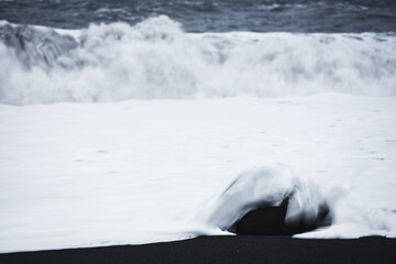 Fototapeta na wymiar Waves on the Black Sand Beach, Vik, Iceland, North Atlantic Ocean