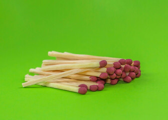 A stack of bright colorful matches on a color background.Wooden safety matches on the white background.