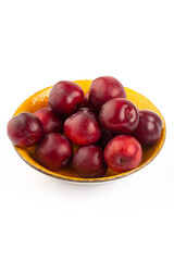 Red round plum on white background