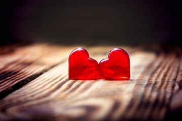 two red hearts on wooden background, close-up, Valentine's day...