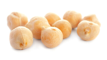 Dried chickpea beans isolated on white background, close-up. Macro photo of dried chickpeas isolated on white background. Dry grains of chickpea isolated on white background. Dry garbanzo close up.