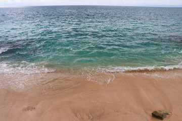 Beautiful Beach, crystal clear blue water and white sand at Tegal Wangi Beach Bali Indonesia