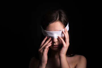 Blindfolded woman closeup. Concept of censorship, human rights, oppression or repression.