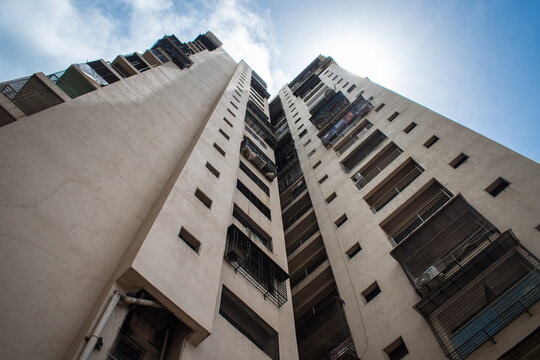 bottom view of residential building with ducts and galleries in perspective in Mumbai,India.looking up view building