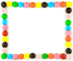 Frame for your photo or text. Colorful candy pills on white isolated background. Bright rainbow sweet cheerful place for your congratulations or note. Mock up