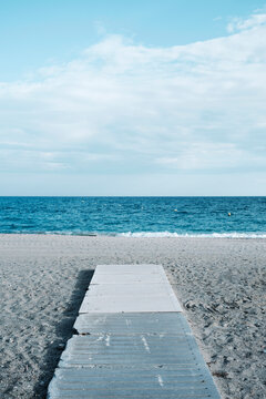concrete walkway in a lonely beach.