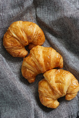 fresh croissant on fabric