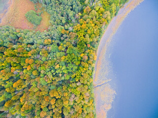 Colorful autumn view of Mamry Lake and Upalty island - the biggest Masurian island, Mazury, Poland