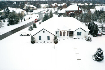 Winter snow storm across the United States covers midwest neighborhoods and homes - obrazy, fototapety, plakaty