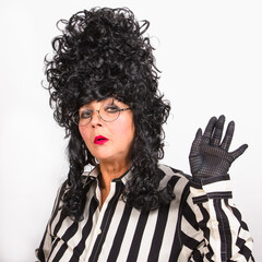 Senior portrait of glamour beautiful woman in baroque aristocrat wig over white background.