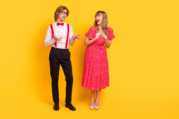 Full length body size photo of couple on date talking laughing overjoyed isolated on vivid yellow...