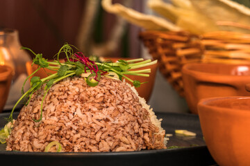 An assortment of Sri Lankan dishes like red rice and papadam bread.