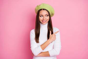 Portrait of pretty cheerful content straight-haired girl showing advert novelty isolated over pink pastel color background