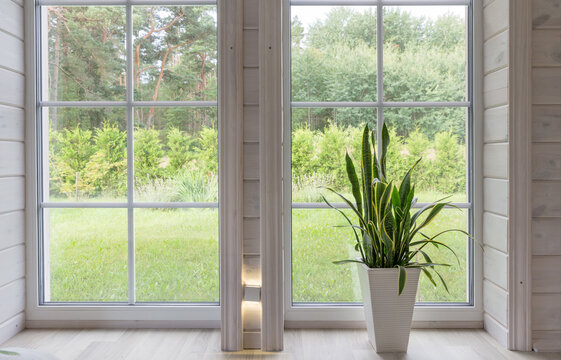 Fototapeta Bright photo studio interior with big window, high ceiling, white wooden floor