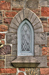 Fototapeta na wymiar Window of stone church of st john the baptist Anglican Lakefield Ontario