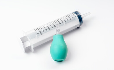 Syringe with rubber bulb on white background. Sore nose concept. Rinsing the nose.