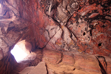 The colorful conformation of rocks inside an excavated tomb, Petra, Jordan