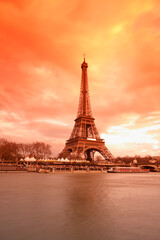 Fototapeta na wymiar Eiffel Tower along he Seine river, Paris, France