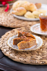Novruz pastry pakhlava, Azerbaijan national holiday, ethnic cuisine eastern desserts for spring equinox celebration in white and golden plate. Persian nooruz sweets, copy space   