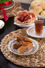 Novruz pastry pakhlava, Azerbaijan national holiday, ethnic cuisine eastern desserts for spring equinox celebration in white and golden plate. Persian nooruz sweets, copy space   