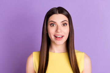Fototapeta premium Portrait of attractive cheerful amazed girl good news reaction isolated over violet purple pastel color background