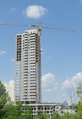 Fototapeta na wymiar high rise building with crane