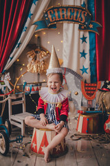 Obraz na płótnie Canvas White boy dressed as a magician. Stylized circus photo zone.