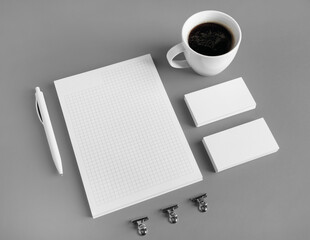 Photo of blank stationery set on gray paper background. Branding mock up.