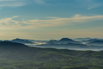 Morning in the mountains. Fog covering the mountain forests.
