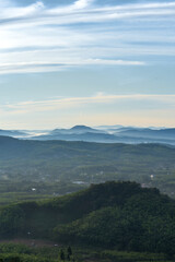 Fototapeta premium Morning in the mountains. Fog covering the mountain forests.