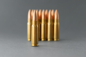 Bullets on gray background. Cartridges 7.62 caliber for Kalashnikov assault rifle closeup....
