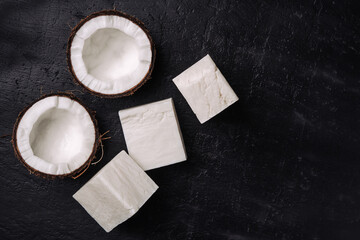 Coconut handmade soap and coco on dark concrete background