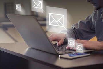 Mail in frames flying away from laptop. Person sending mail in office. Communication, remote...