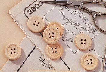 Tailoring buttons and scissors close-up