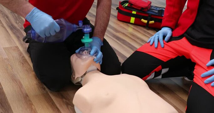 Cardiopulmonary resuscitation. Training demonstration of a chest compression and breathing on a phantom. Adult CPR training and First Aid Instruction