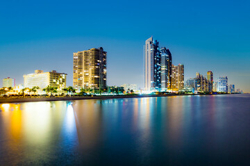 Fototapeta na wymiar skyline of Miami sunny isles by night with reflections in the water
