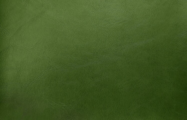 close up green olive leather texture background. abstract vintage concept background. top view of genuine leather.