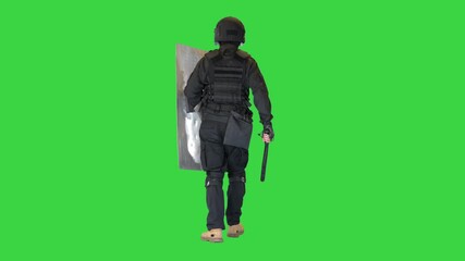 Riot police unit walking with a shield and baton on a Green Screen, Chroma Key.