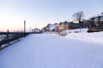 West view of famous Dufferin Terrace in the old town seen with a fresh coat of snow during a blue hour winter morning, Quebec City, Quebec, Canada