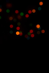 Colorful shiny bokeh lights. New year celebration lights. Space for text. Story background.