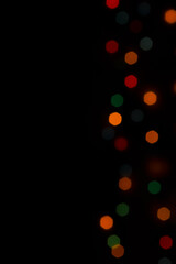 Colorful shiny bokeh lights. New year celebration lights. Space for text. Story background.