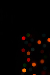 Colorful shiny bokeh lights. New year celebration lights. Space for text. Story background.