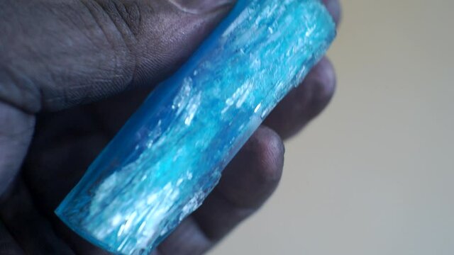 dirty hand holding a big beautiful crystal.close-up.shallow depth of field
