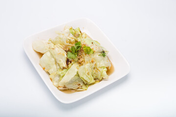 Stir Fried Cabbage with Fish Sauce, White Square Plate on white background