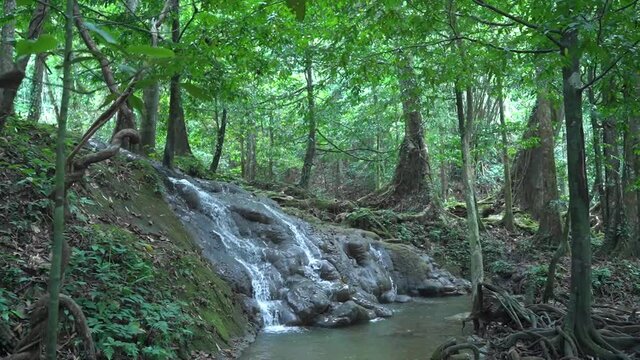 Sa Nang Manora waterfall in Phang Nga, Thailand, wonderful fresh water, small green waterfalls. Looks comfortable.