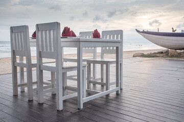 romantic dinner table setup on tropical beach