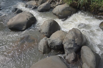 Big rock on the river with a natural background