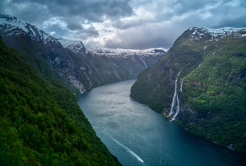 Seven sisters waterfall in Norway. Dramatic sky in Norvegian fjords.